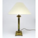 A brass table lamp of column form on squared base. Approx. 18" high Please Note - we do not make