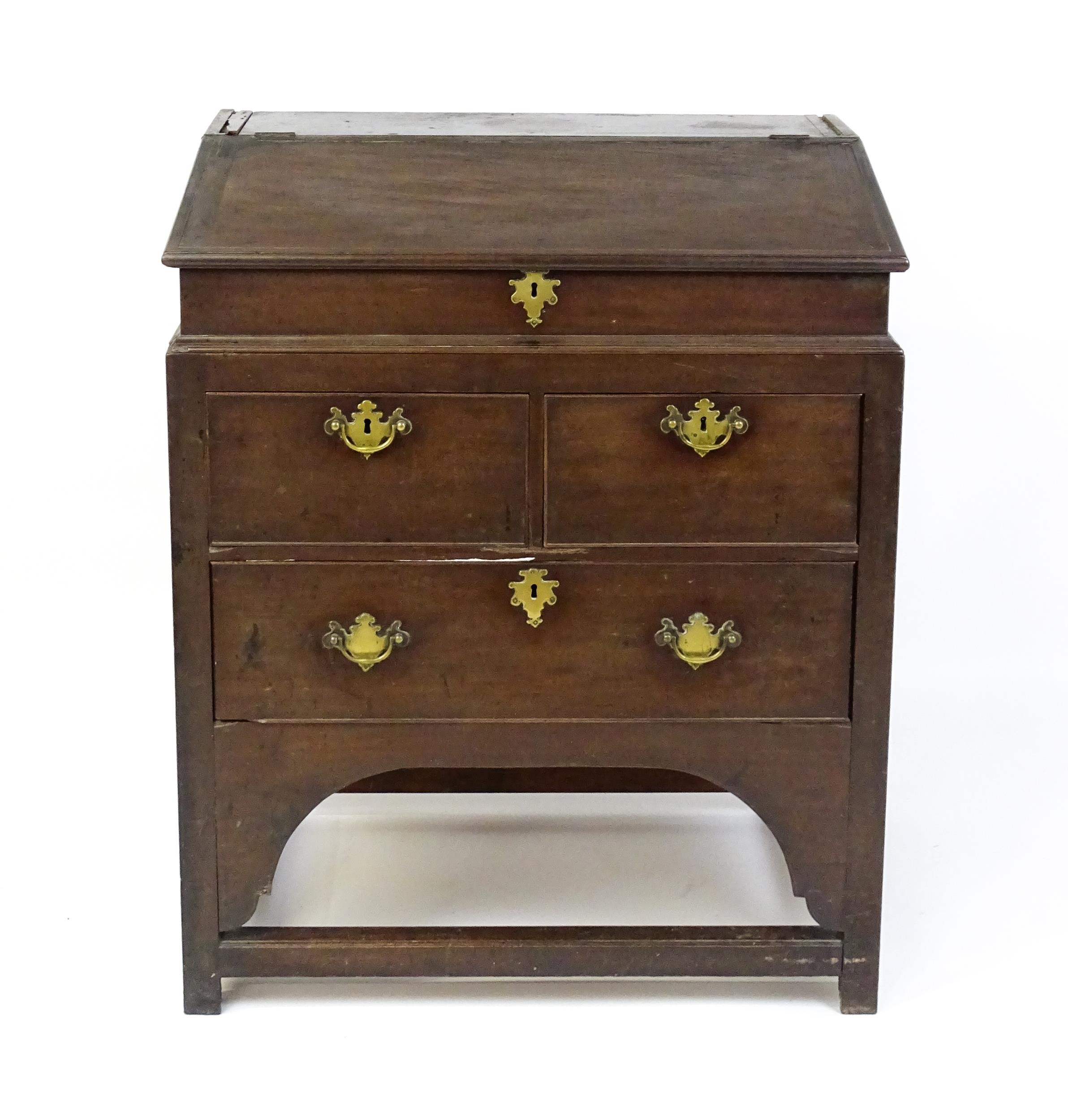 An early / mid 18thC mahogany clerks desk with a hinged sloping lid opening to show a fitted - Image 5 of 8