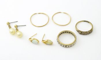 A quantity of assorted 9ct, yellow metal and gilt metal jewellery to include rings and earrings.