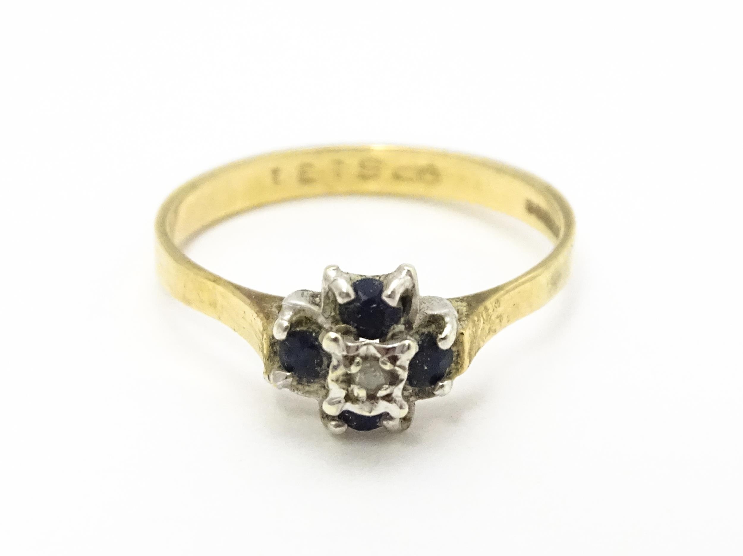 A 9ct gold ring set with diamonds and blue stones. Ring size approx. L Please Note - we do not - Image 2 of 7