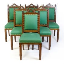A set of six 19thC Gothic oak dining chairs , the upright supports having trefoil capitals