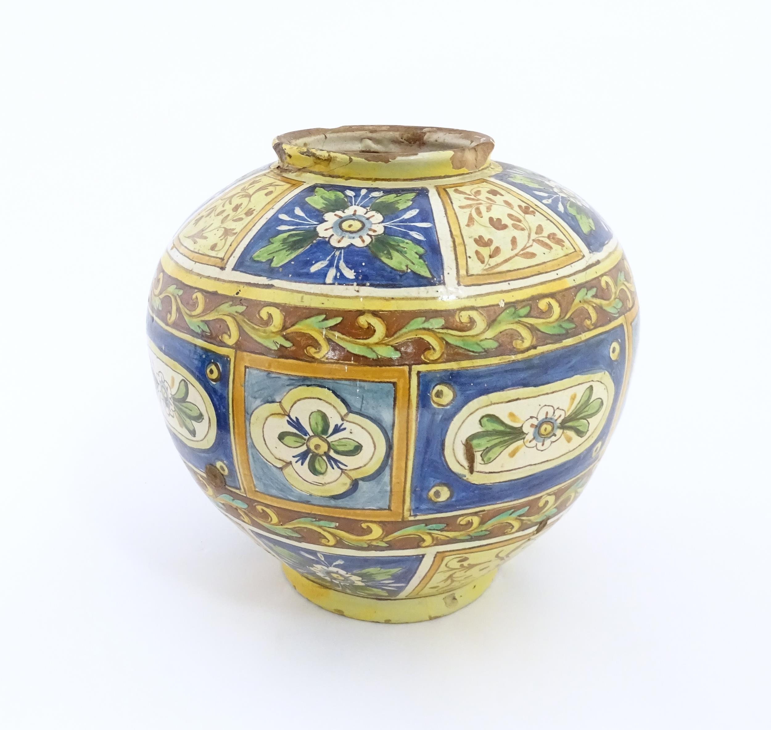 A Sicilian maiolica Bombola vase with panelled and banded decoration depicting flowers and - Image 7 of 10