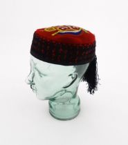 A 20thC traditional Croatian Lika cap / Licka Kapa with embroidered crest to top and fringe