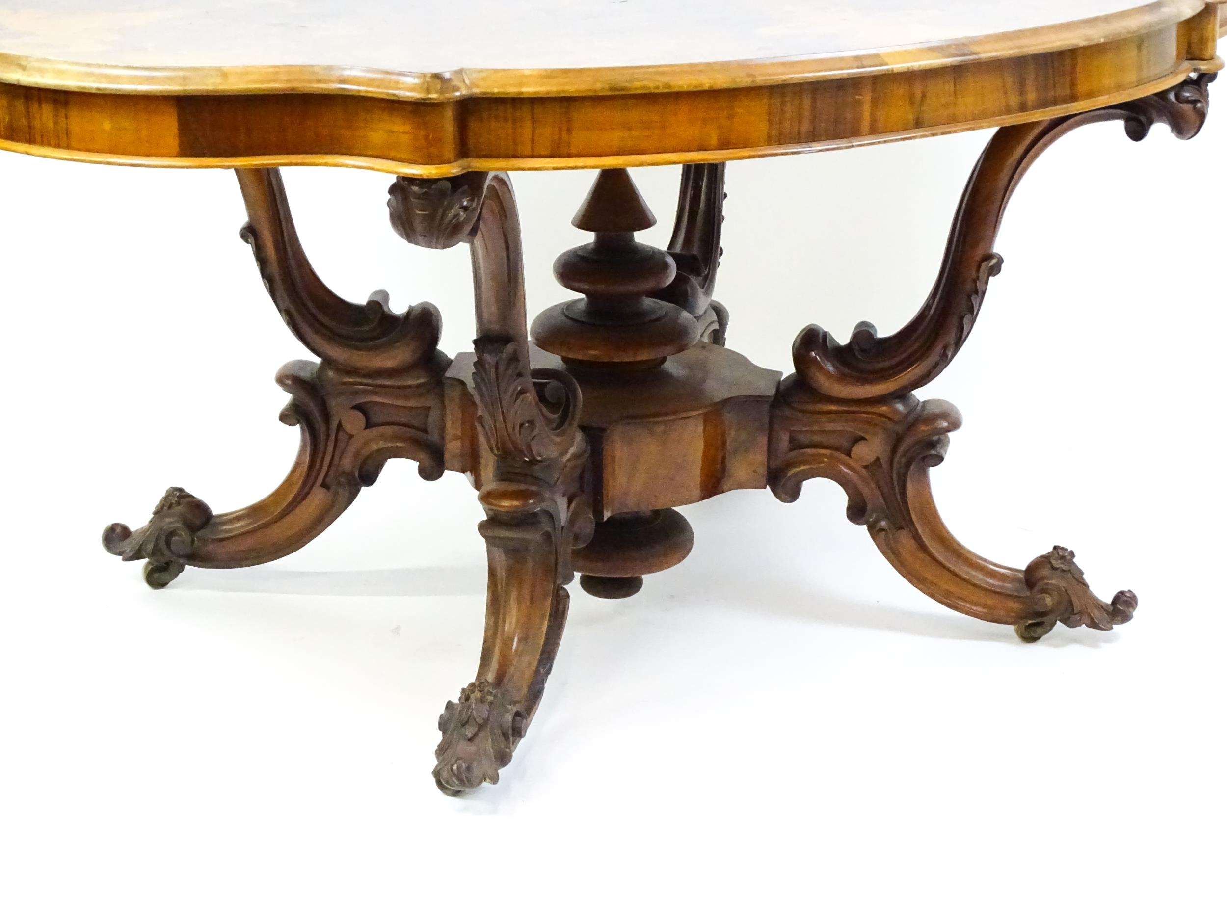 A 19thC burr walnut centre table with a moulded top above four acanthus carved supports, a large - Image 4 of 16