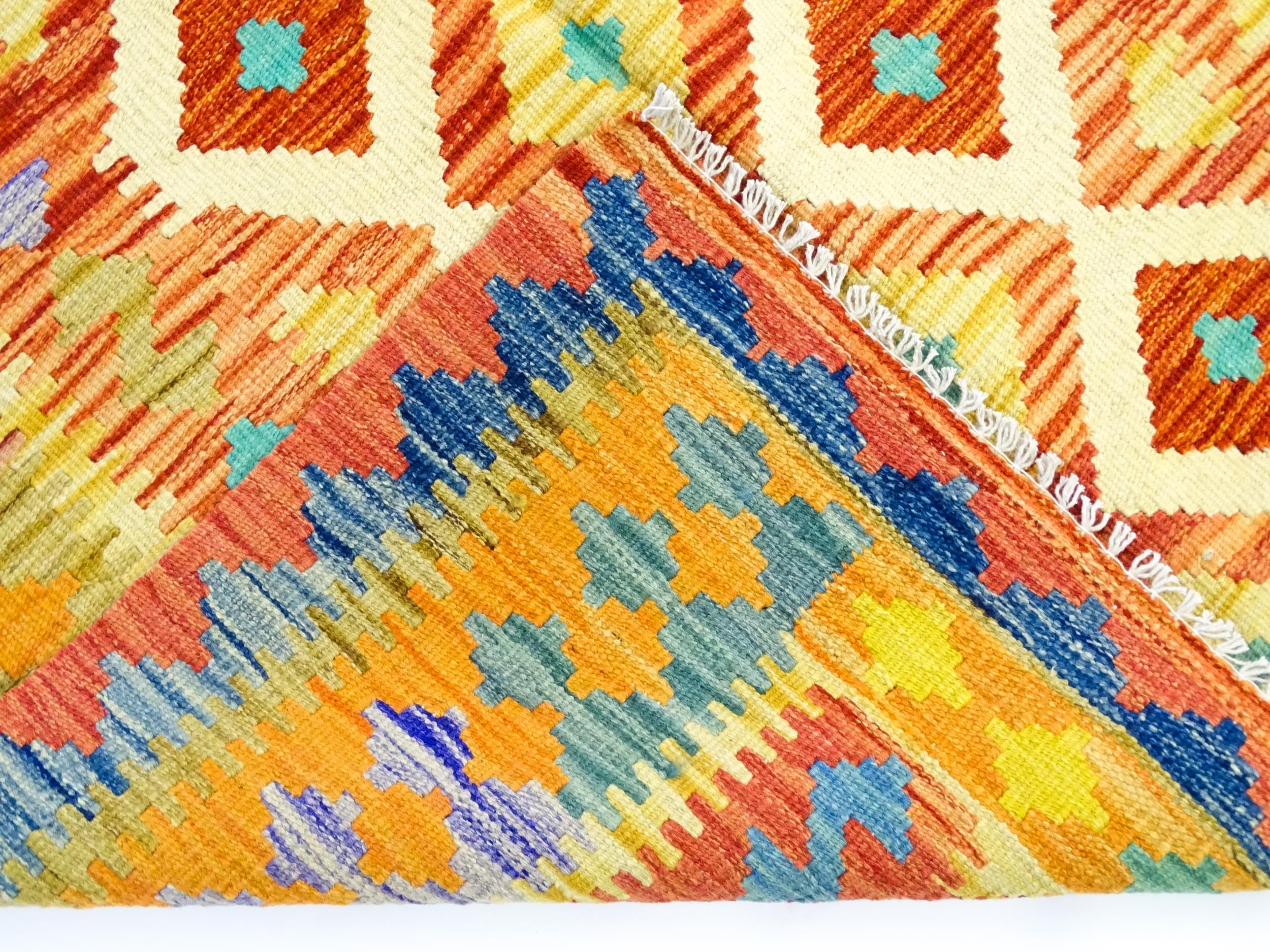 Carpet / Rug : A Turkish Anatolian kilim rug with repeating geometric motifs. Approx. 72" x 48" - Image 2 of 7