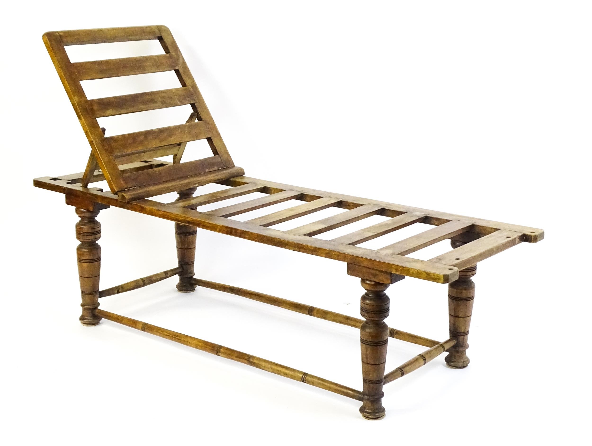 A late 19thC 'Leveson & Sons' campaign bed /day bed with a slatted bed and adjustable headrest above - Image 6 of 9