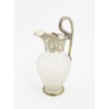 A Victorian frosted glass jug of ewer form with silver plate handle and mounts. Approx. 11 1/2" high