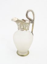 A Victorian frosted glass jug of ewer form with silver plate handle and mounts. Approx. 11 1/2" high