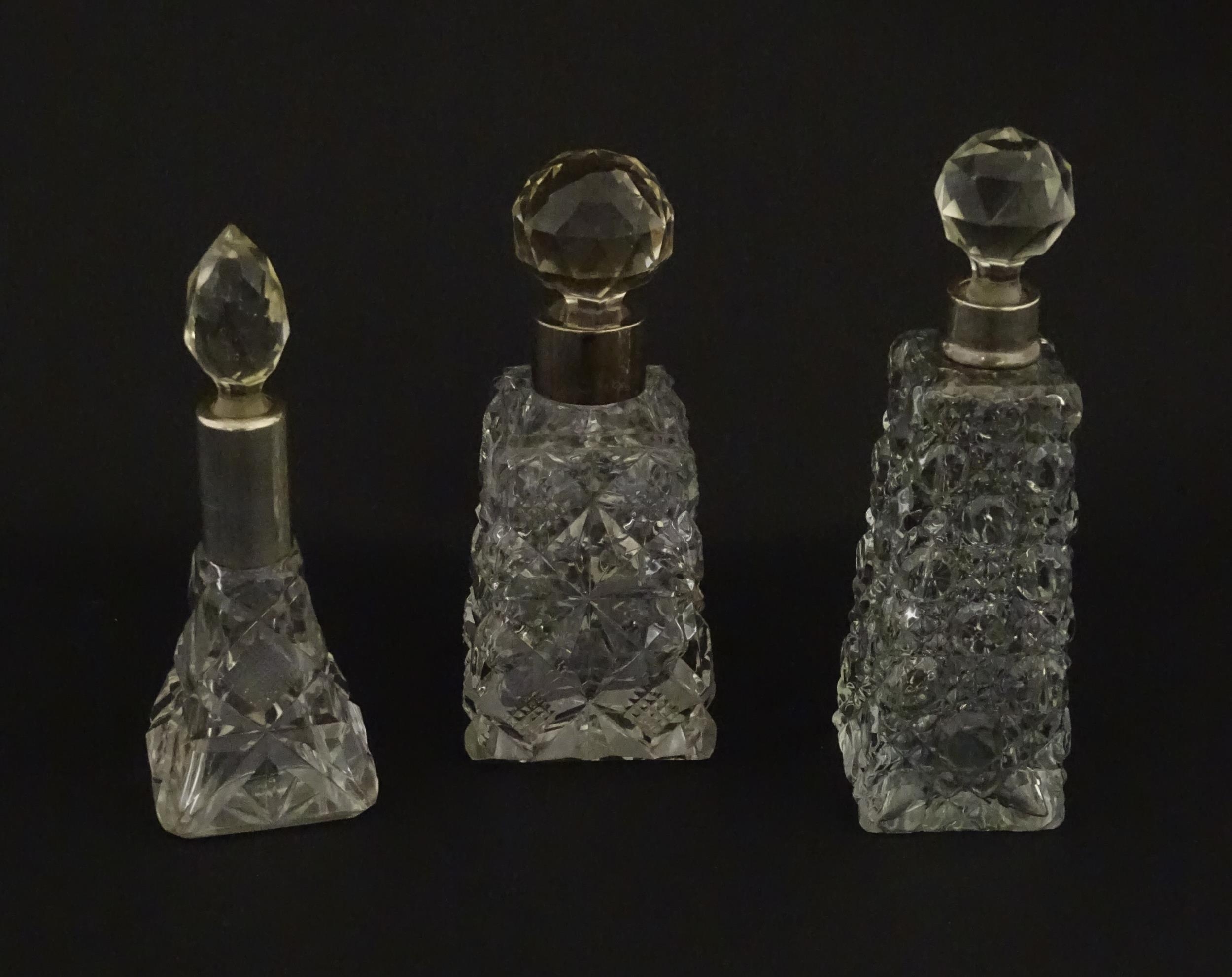 Three assorted cut glass scent / perfume bottles with silver mounts, to include one hallmarked - Image 5 of 10