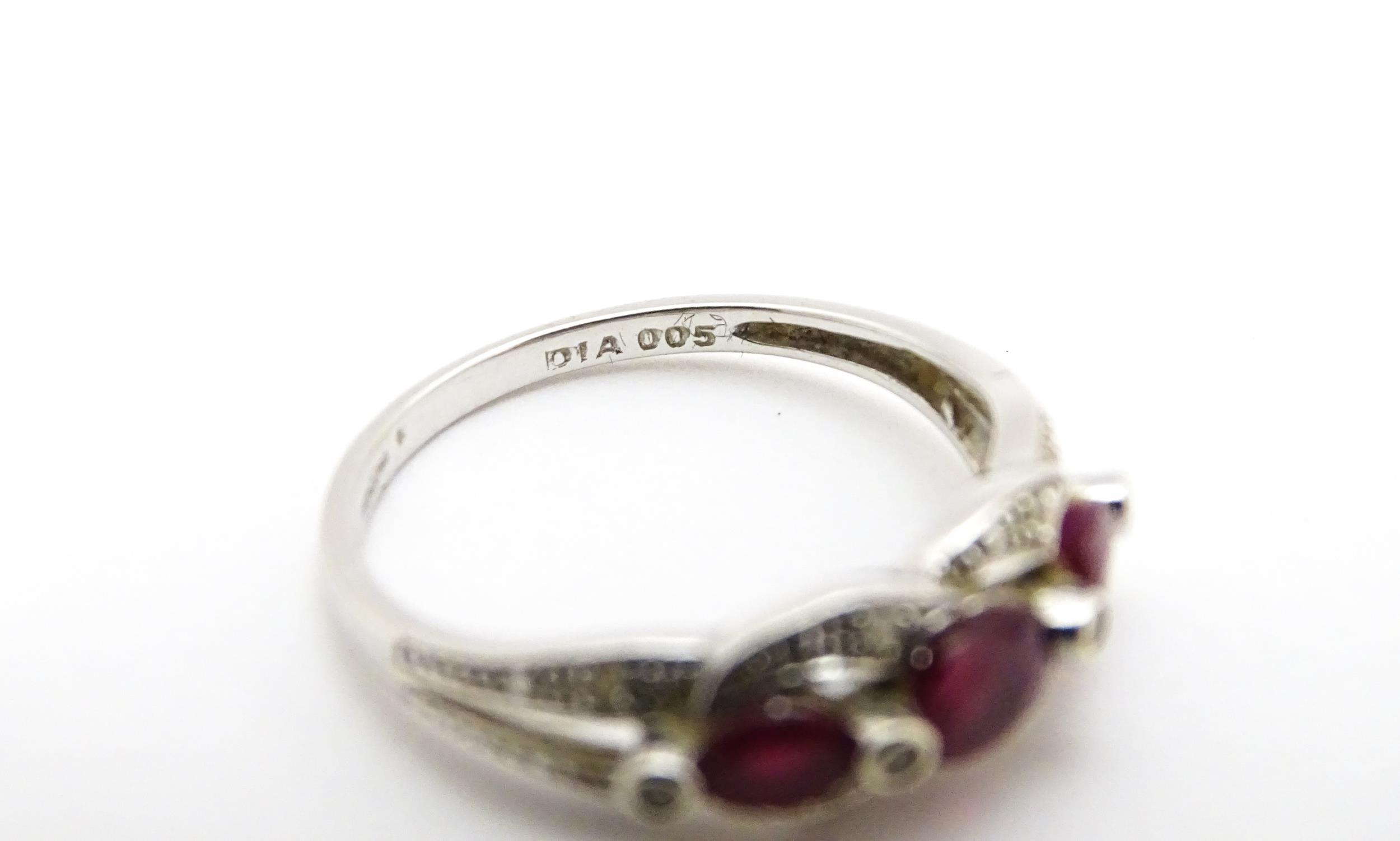 A 9ct white gold ring set with rubies and diamond. Ring size approx. M 1/2 Please Note - we do not - Image 7 of 7