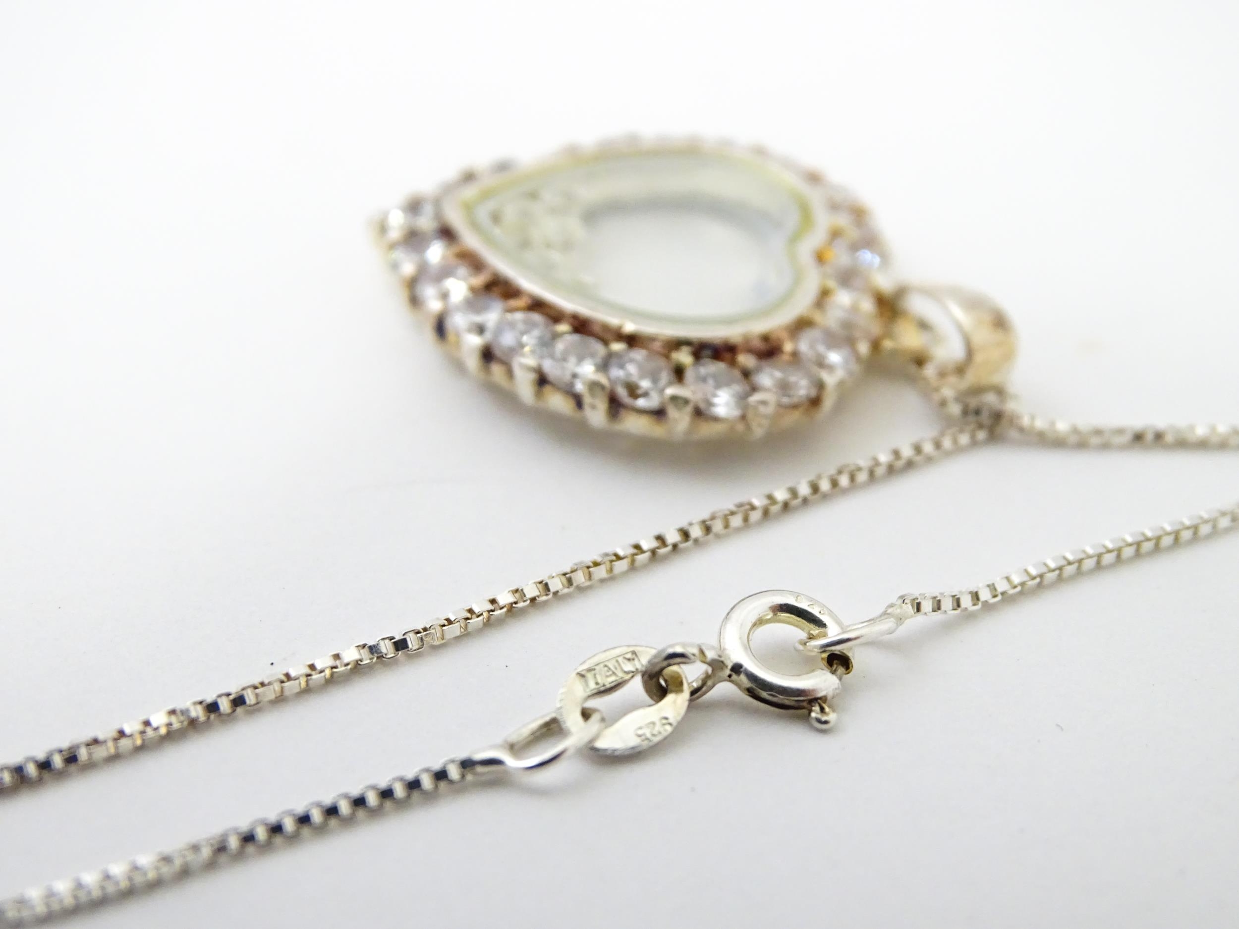 A silver chain with heart shaped locket pendant set with white stones with further white stones - Image 5 of 6