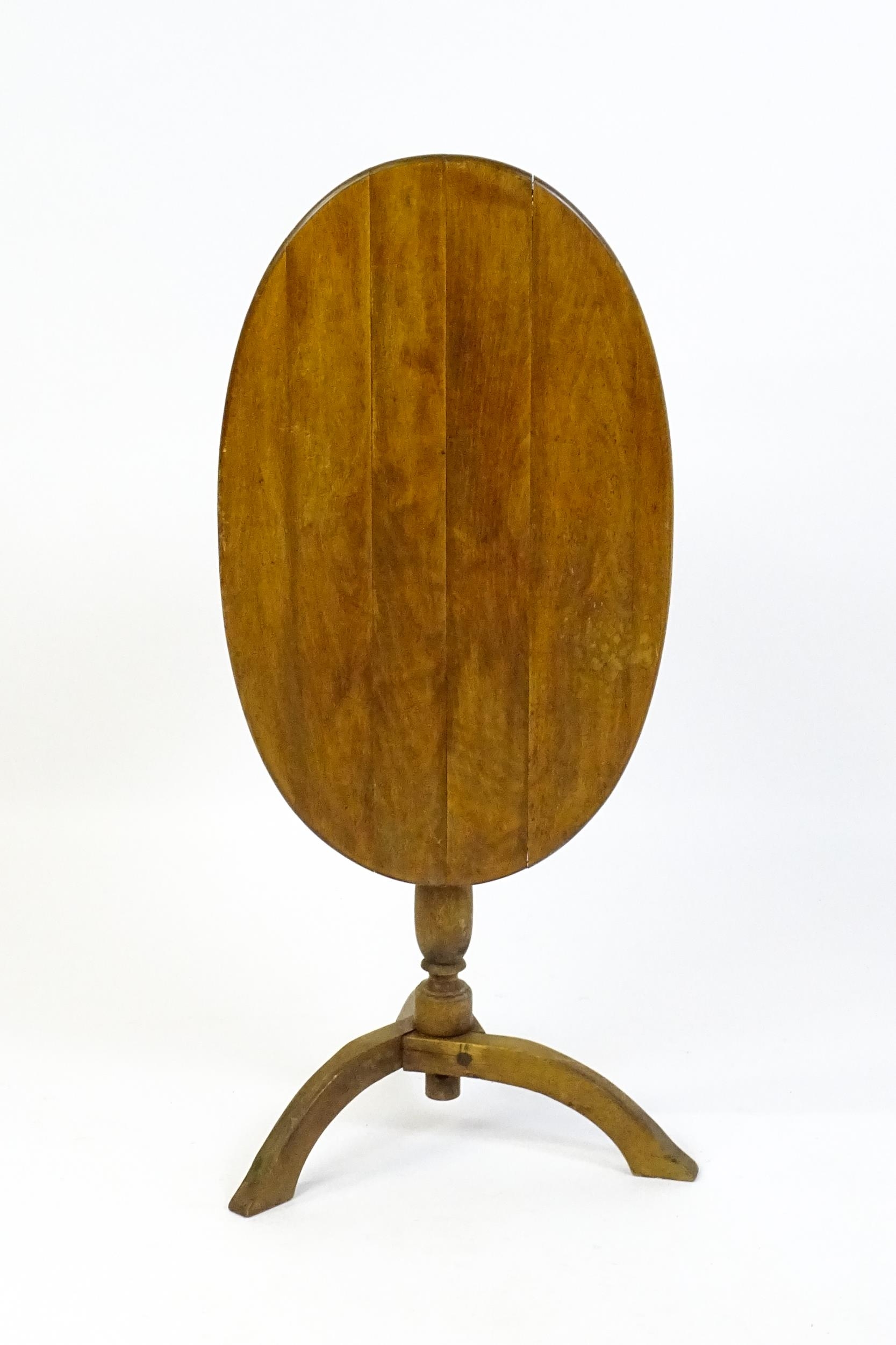 An early 20thC New England style occasional table, with an oval planked top, a storage compartment - Image 3 of 6