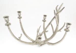 A 20thC cast candelabra / candle stand of antler form with five sconces. Approx. 18" high x 21" wide