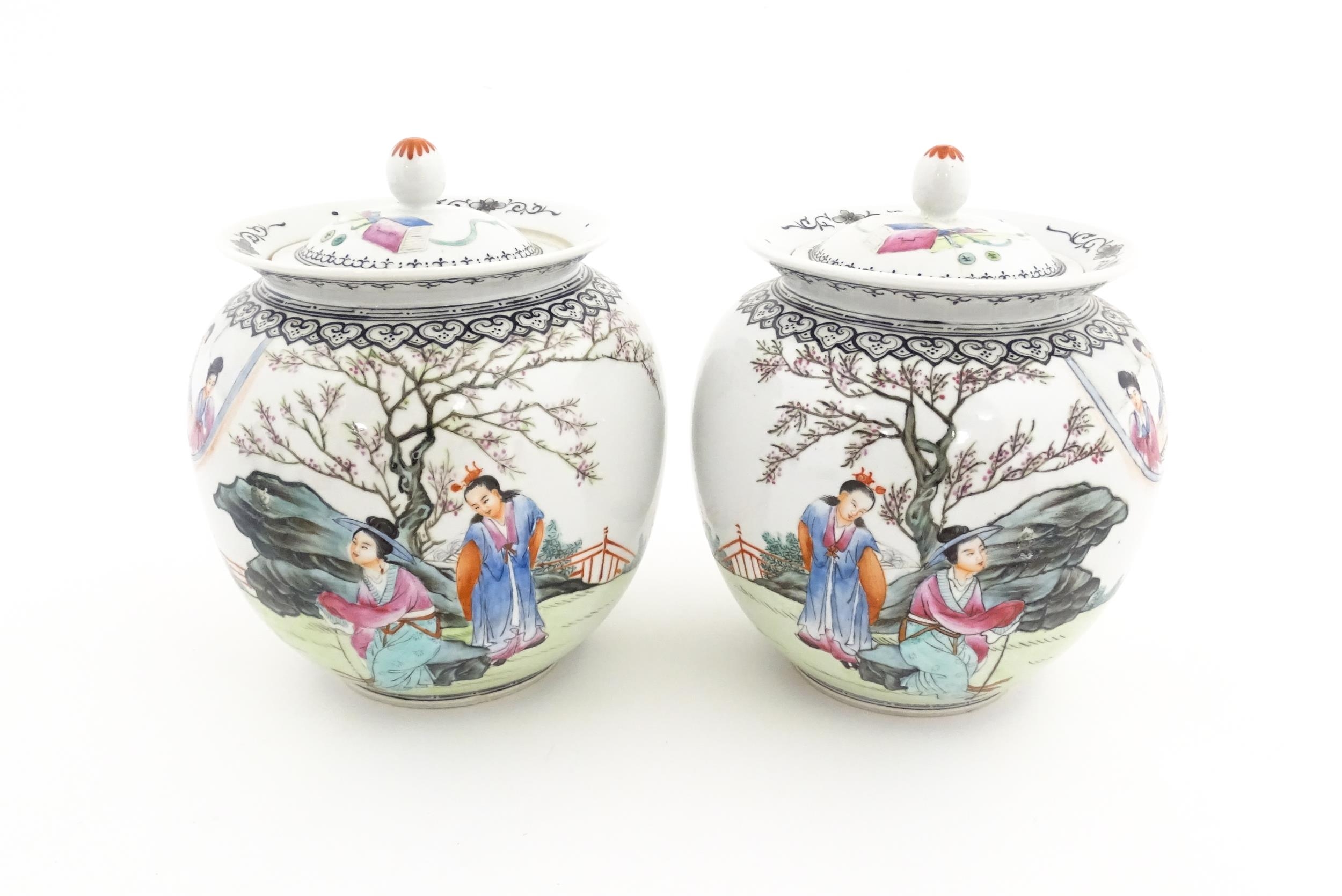A pair of Chinese pot and cover vases decorated with ladies in a landscapes, and Character script. - Image 3 of 10