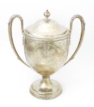 A Geo III silver twin handled presentation trophy cup and cover with engraved heraldic Prince of