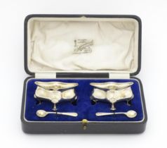 A pair of silver salts of shaped form hallmarked Birmingham 1918 / 1919, maker E. S. Barnsley &