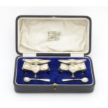 A pair of silver salts of shaped form hallmarked Birmingham 1918 / 1919, maker E. S. Barnsley &