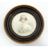 A 19thC pencil and watercolour portrait miniature depicting a portrait of a young lady wearing a