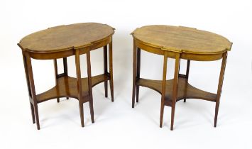 A pair of late 19thC / early 20thC mahogany side tables, each with shaped tops and having eight