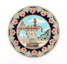 A Longwy plate decorated in enamels depicting the Stanislas Gate of Nancy, France. Approx. 10"