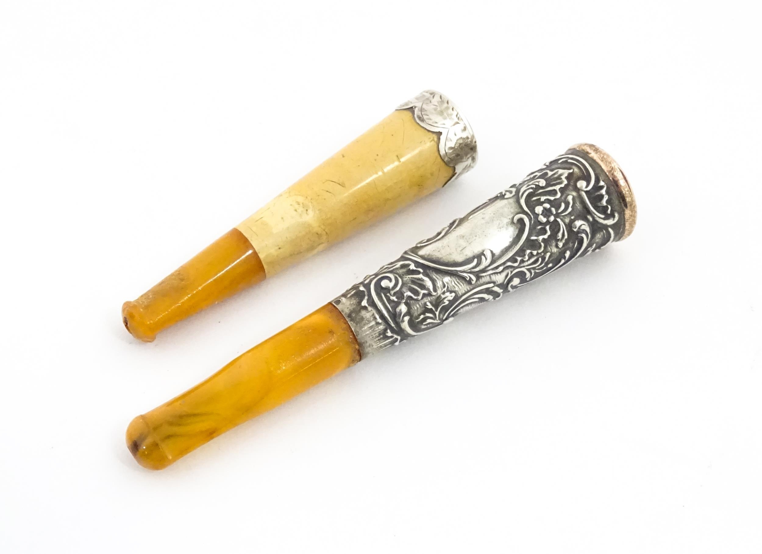 Two amber cheroot mouthpiece holders with white metal mounts, one with meerschaum detail. On - Image 5 of 8