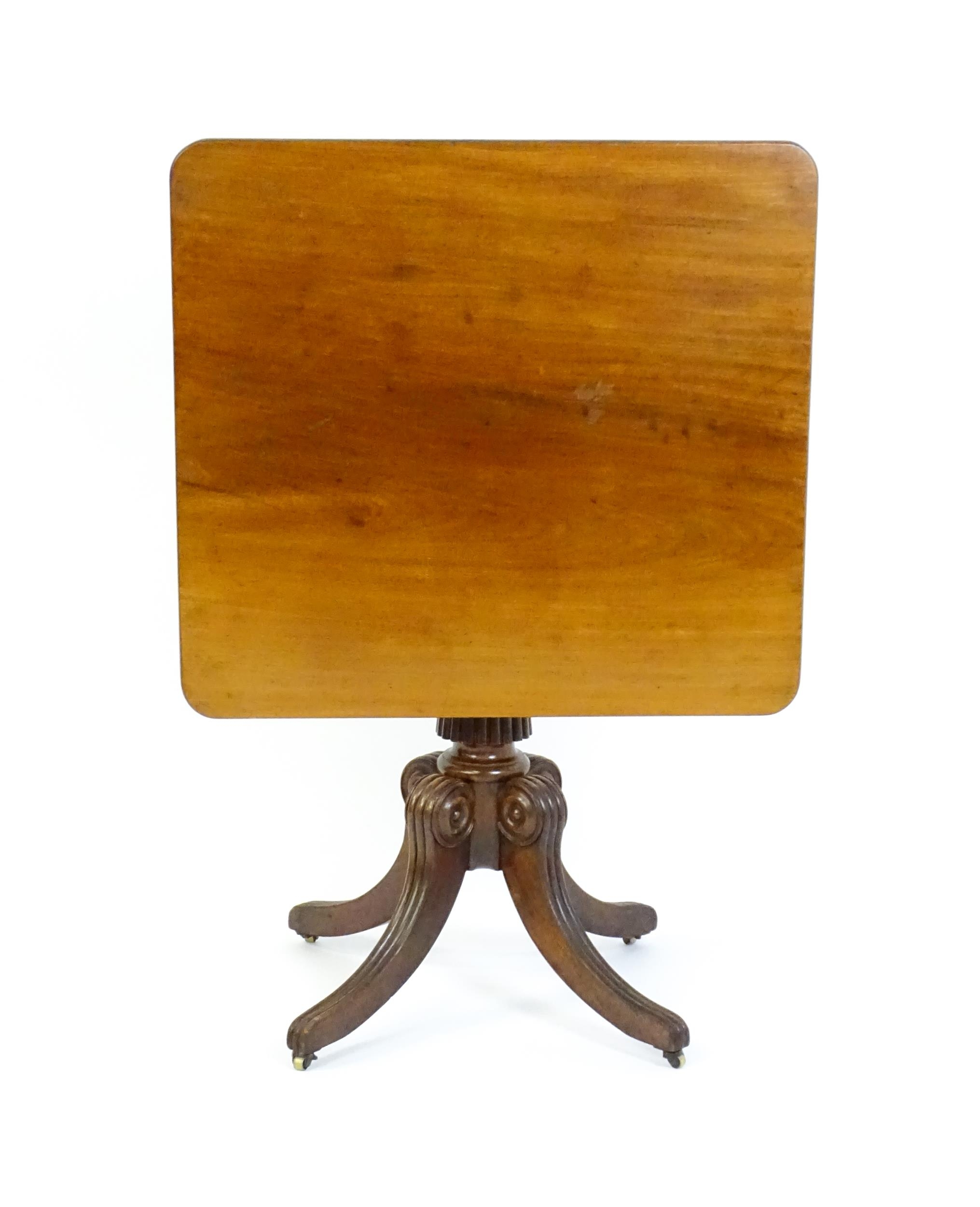 A 19thC mahogany occasional table, with a reeded tapering pedestal and raised on four reeded legs - Image 3 of 8