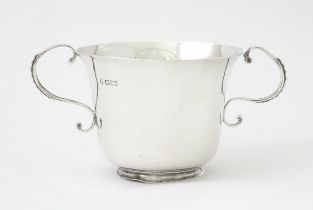 A twin handled silver bowl, hallmarked Chester 1905 maker George Nathan & Ridley Hayes, 2 3/4"