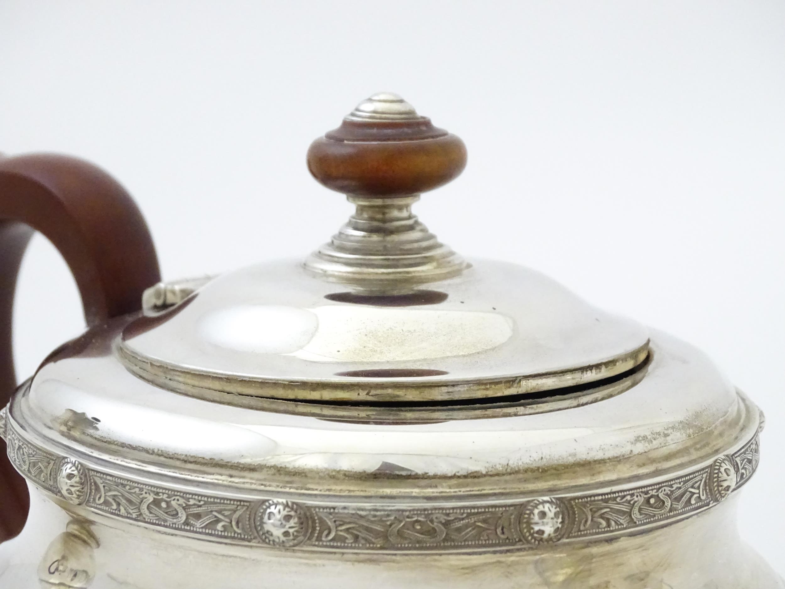 A three piece silver tea set comprising teapot, hot water pot and cream jug, with Celtic style - Image 5 of 20