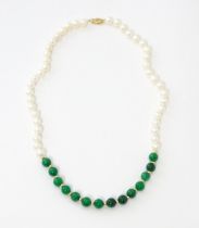 A necklace of jade beads and pearls with 14ct gold clasp. Approx 18" long Please Note - we do not