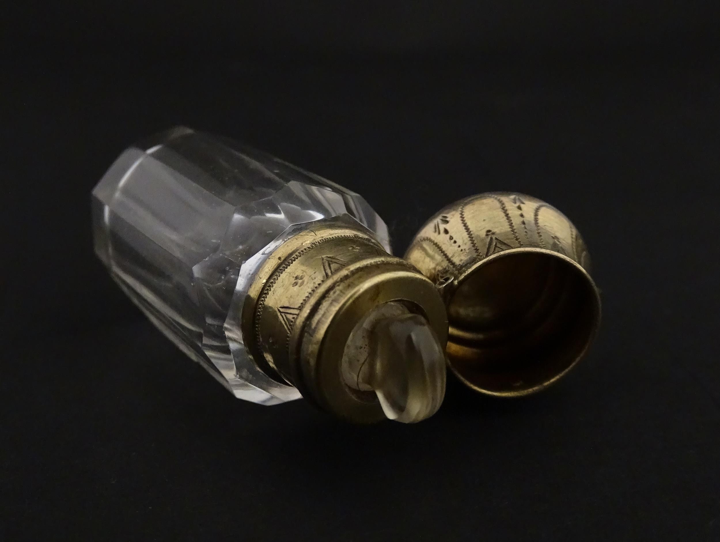 A French scent / perfume bottle with silver gilt top. Approx. 2 1/4" high Please Note - we do not - Image 2 of 10