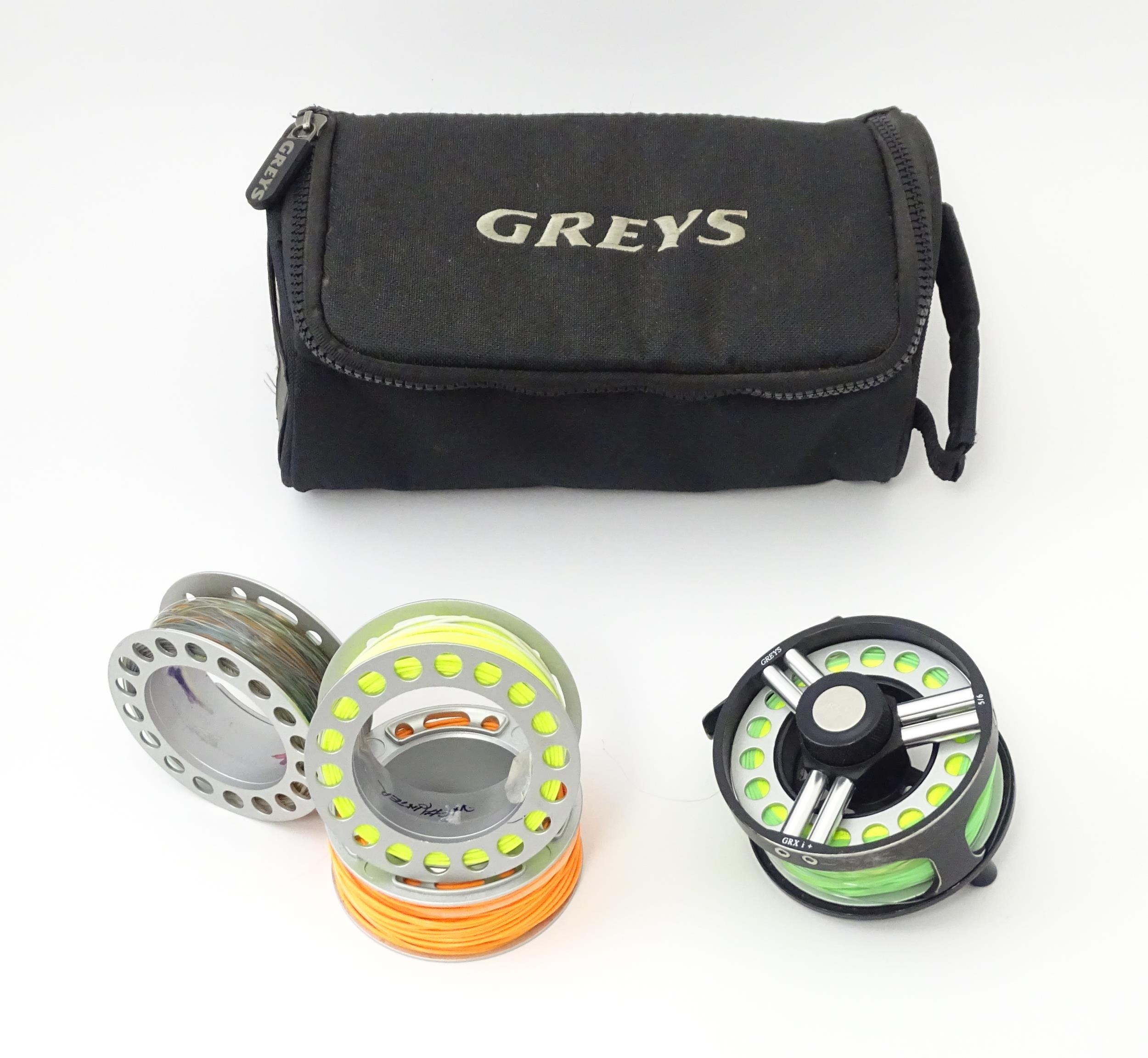 Fishing : a cased Greys GRX i+ centrepin fly reel and three spools (with line), the reel approx 3