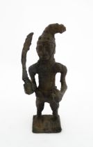 Ethnographic / Native / Tribal : An African cast bronze model of a warrior holding a weapon. Approx.