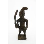 Ethnographic / Native / Tribal : An African cast bronze model of a warrior holding a weapon. Approx.