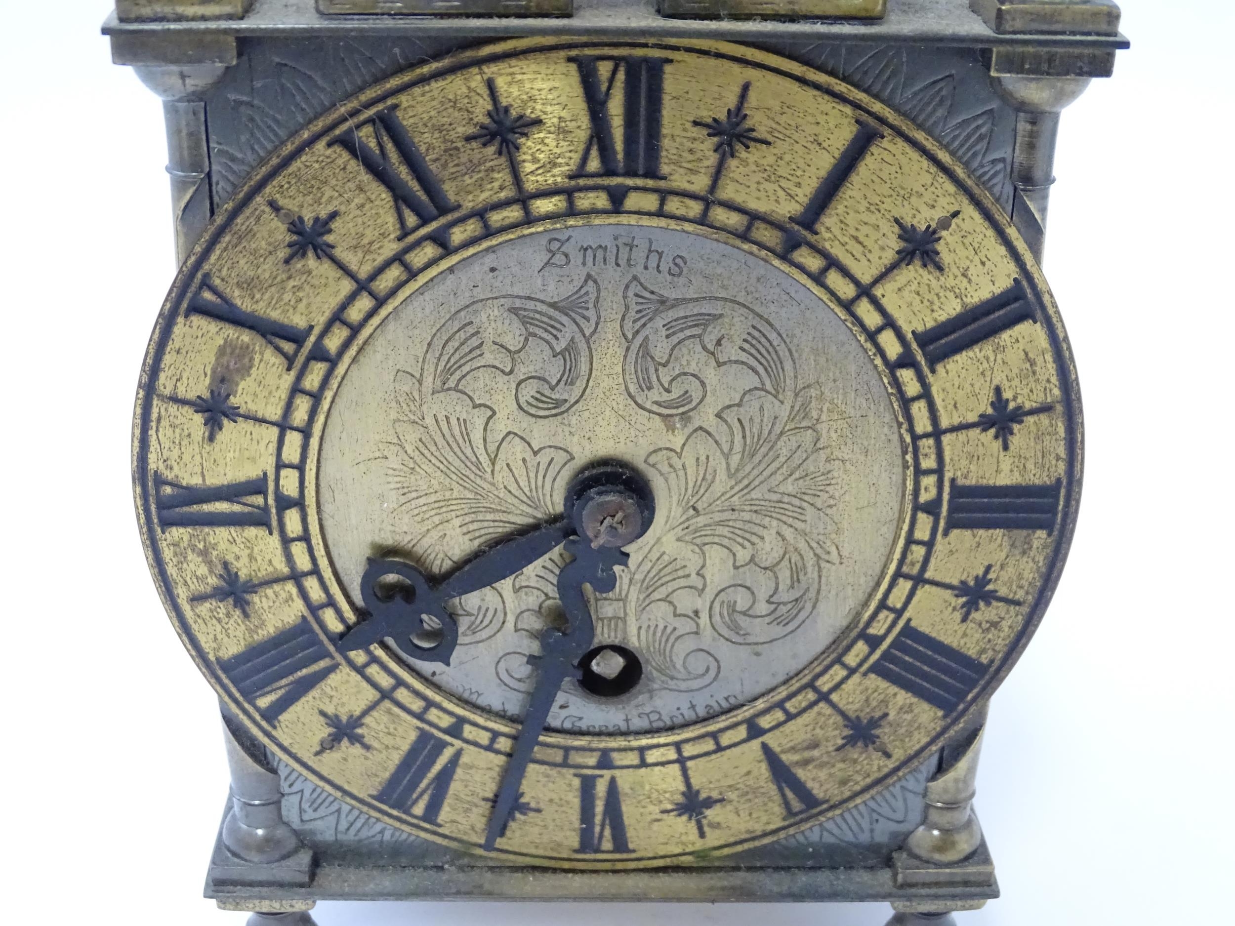 Smiths - Great Britain : A 20thC brass lantern clock by Smiths with engraved dial and Roman - Image 6 of 11
