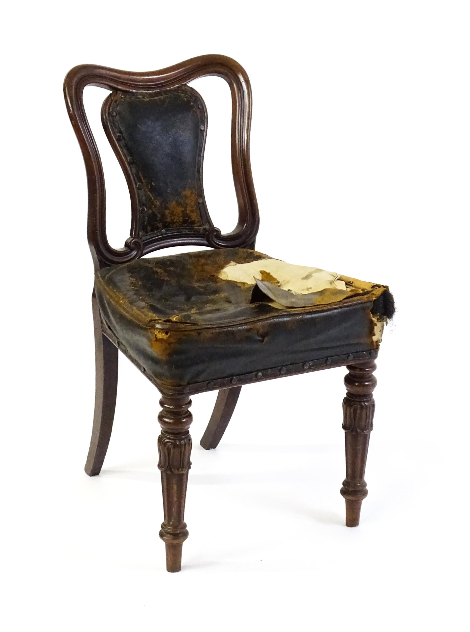 A 19thC mahogany side chair with a moulded and shaped backrest, vase shaped back splat and a leather