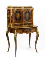 A 19thC kingwood Bonheur du jour surmounted by a brass gallery and having a profusely inlaid