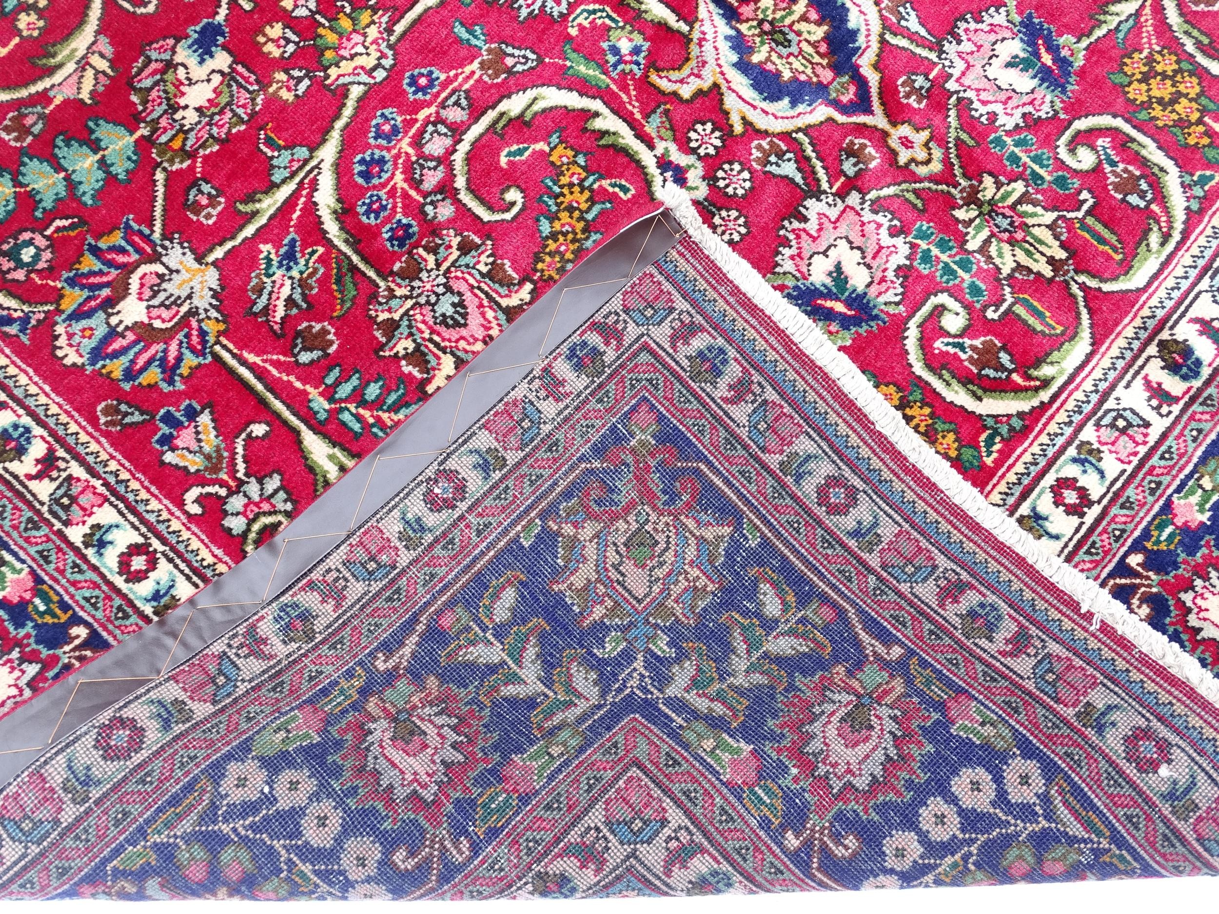 Carpet / Rug: A North West Persian Tabriz carpet the red ground with central cream and blue - Image 2 of 11