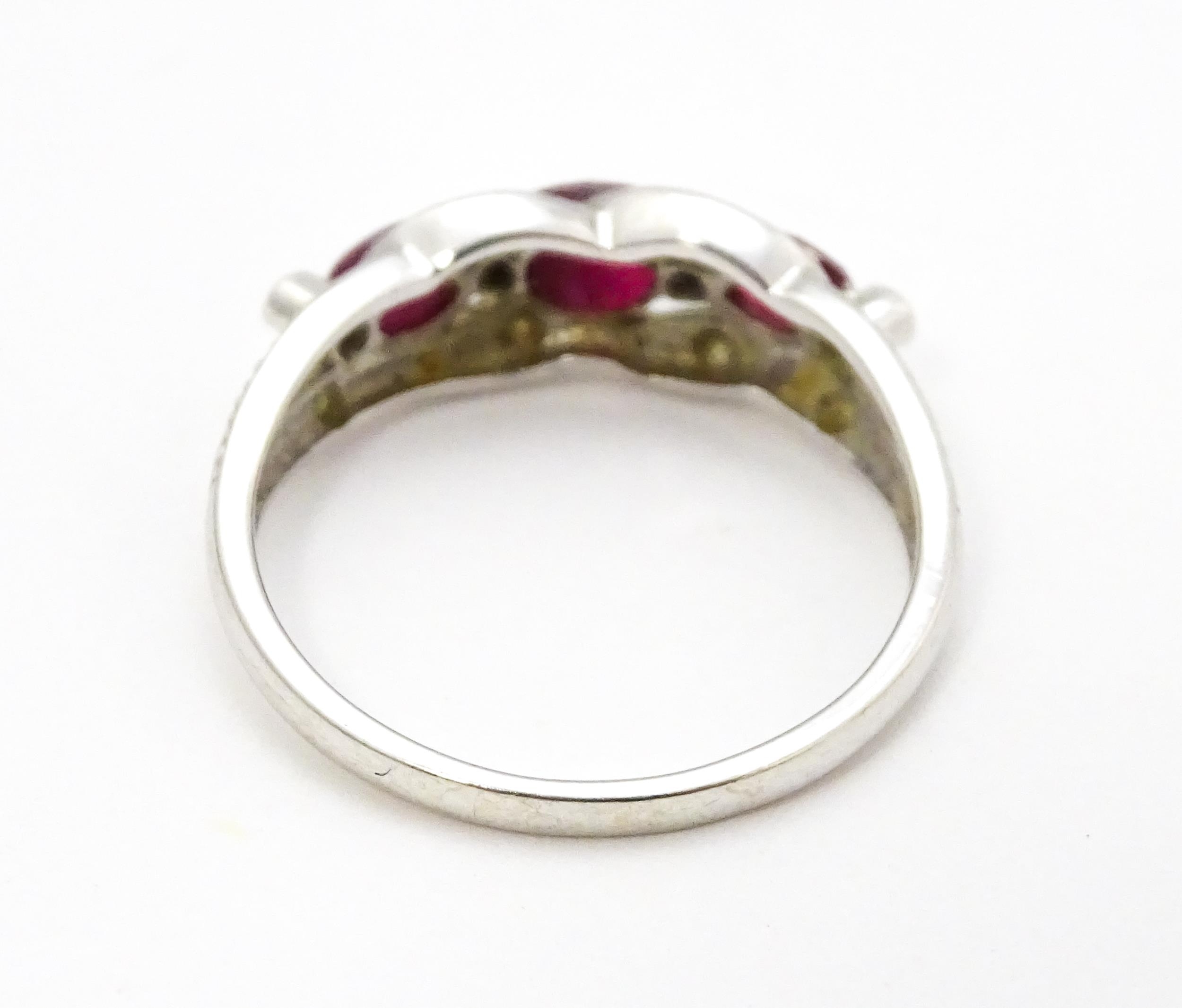 A 9ct white gold ring set with rubies and diamond. Ring size approx. M 1/2 Please Note - we do not - Image 6 of 7