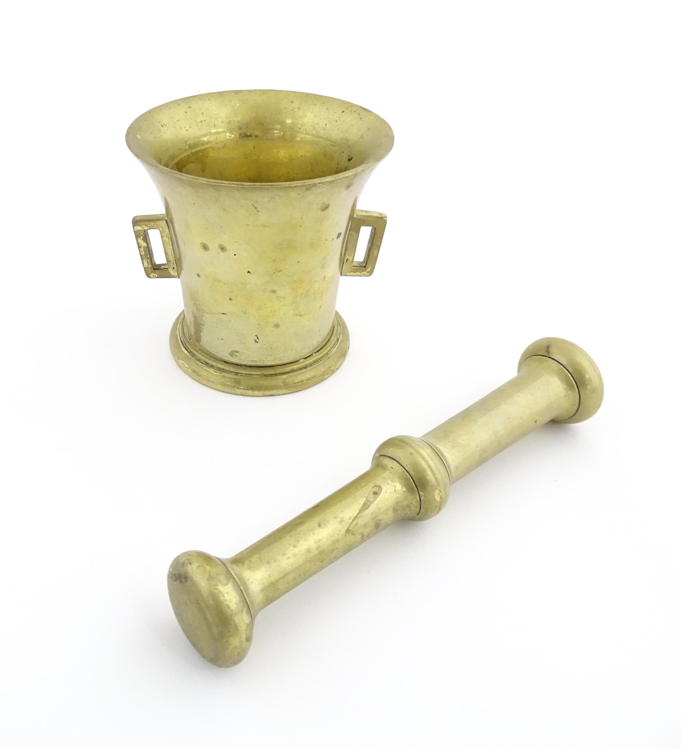 A 19thC brass pestle and mortar, the mortar of tapering form with twin rectangular handles. Mortar - Image 3 of 14