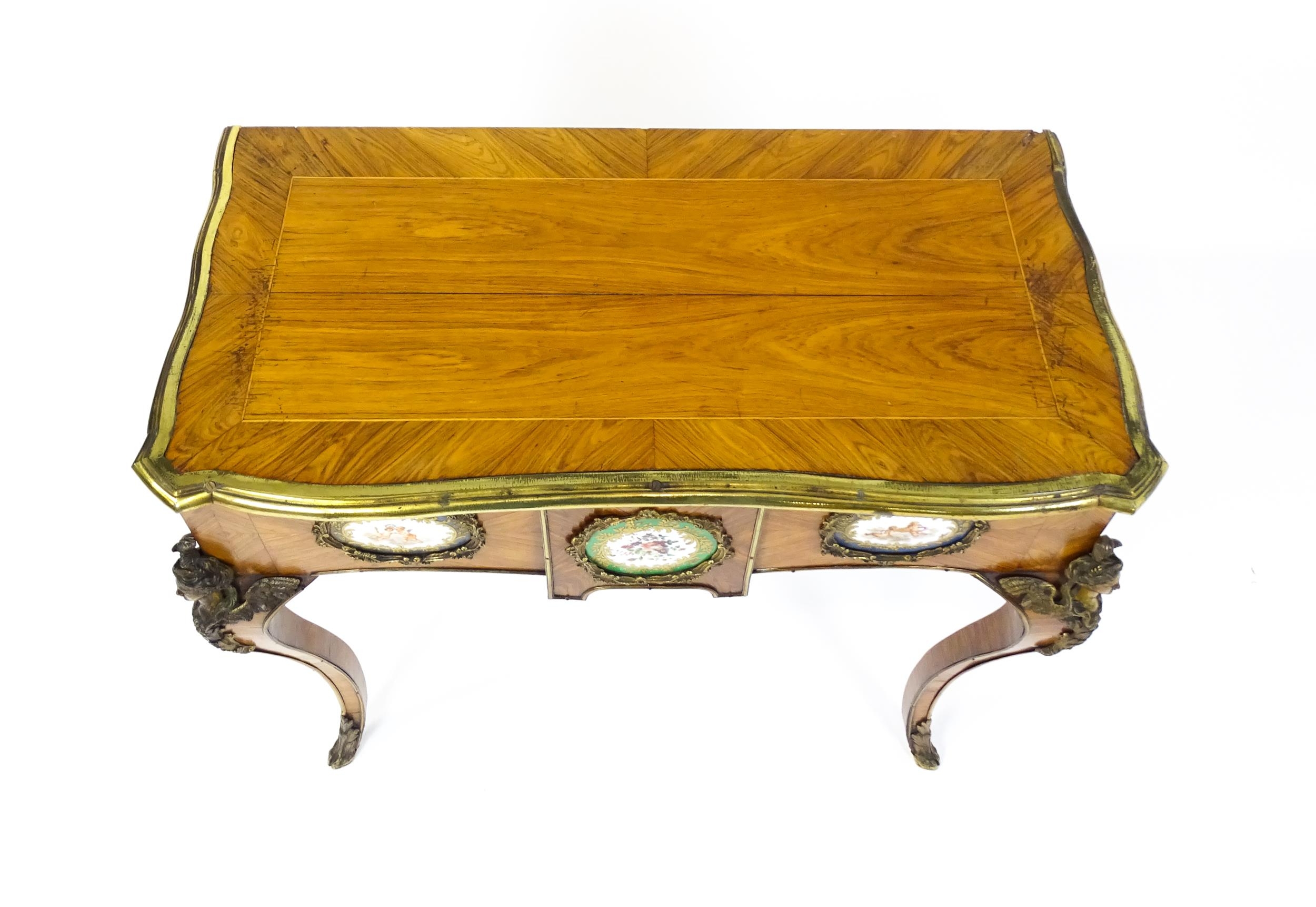 A mid 19thC kingwood side table with a brass moulding to the top edge and three Sevres style plaques - Image 7 of 14