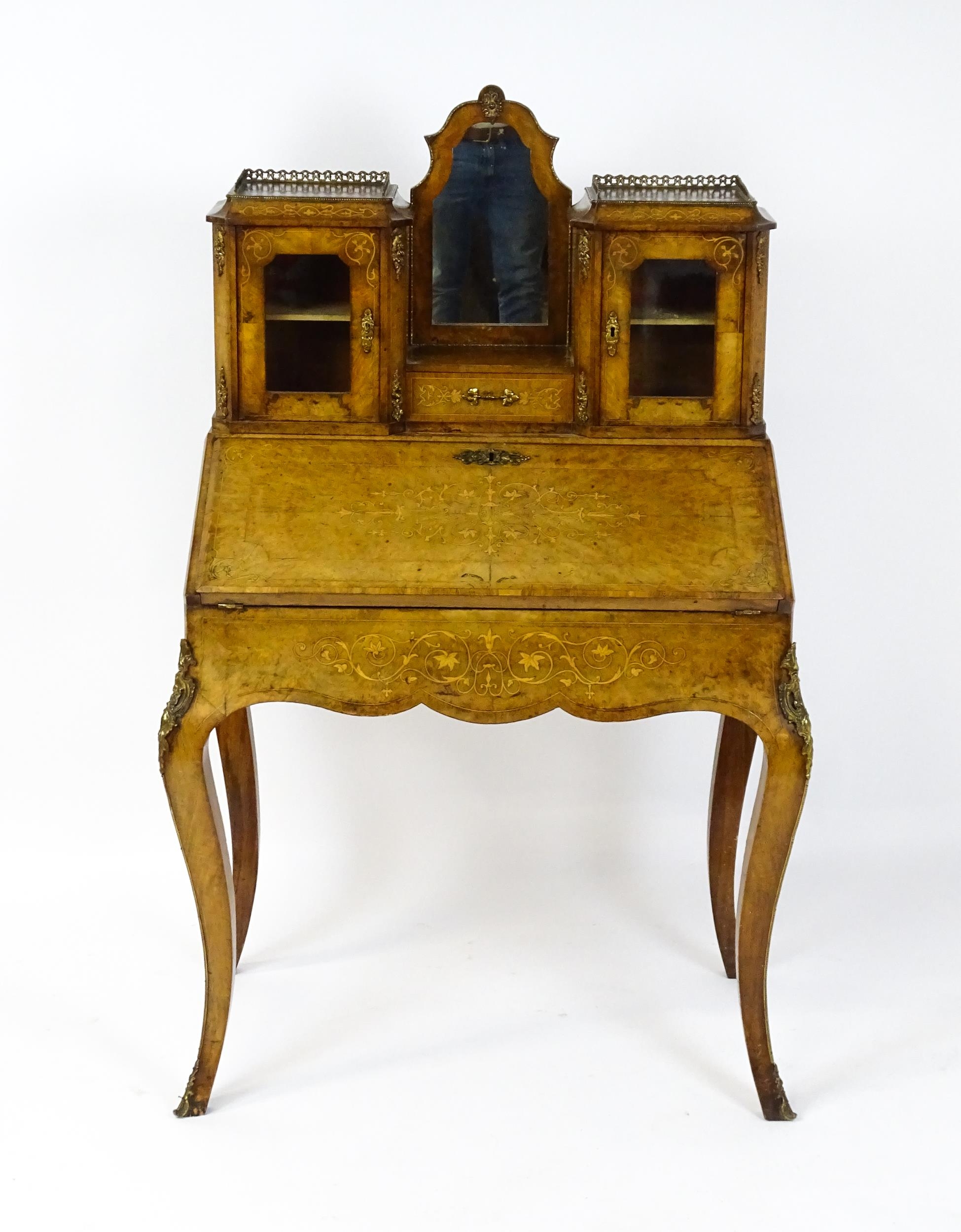 A 19thC burr walnut Bonheur du jour with a mirrored back stand and flanked by two glazed cabinets - Image 10 of 11