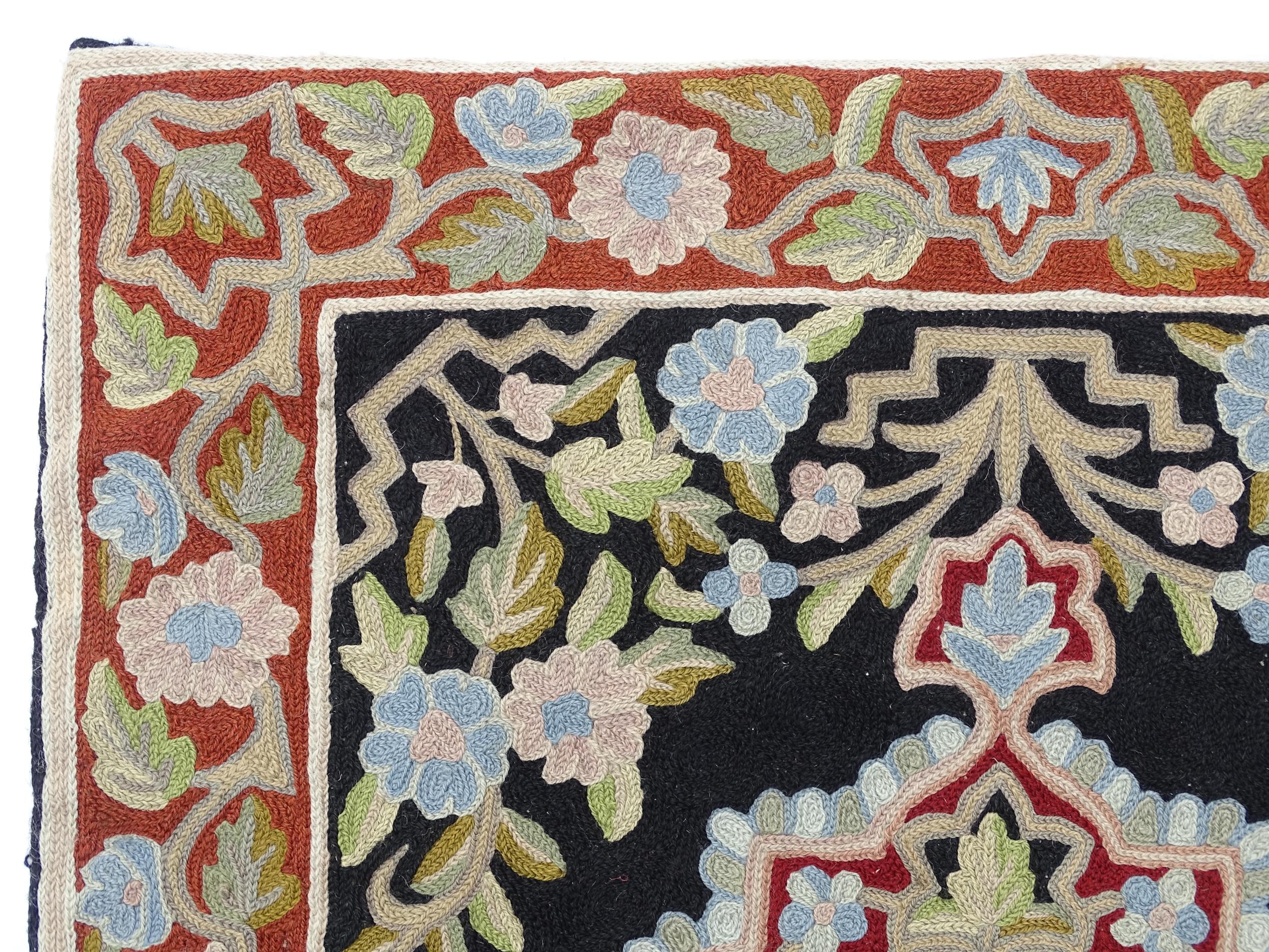 Carpet / Rug : A black and red ground rug with floral and foliate detail. Approx. 35" x 24 1/2" - Image 3 of 7