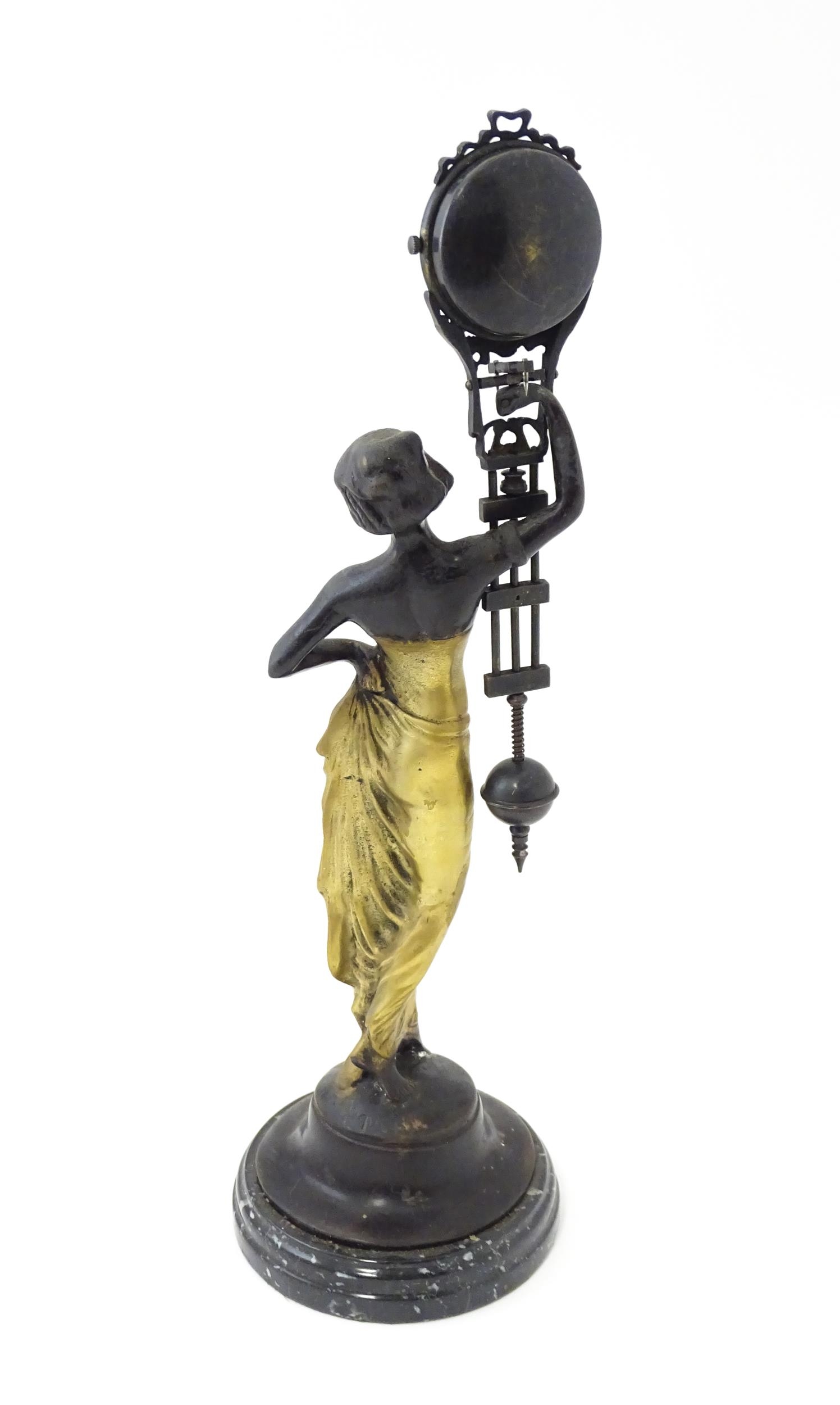 A Continental Art Nouveau style mystery clock (swing clock), with figural detail. Approx. 11 1/2" - Image 5 of 10