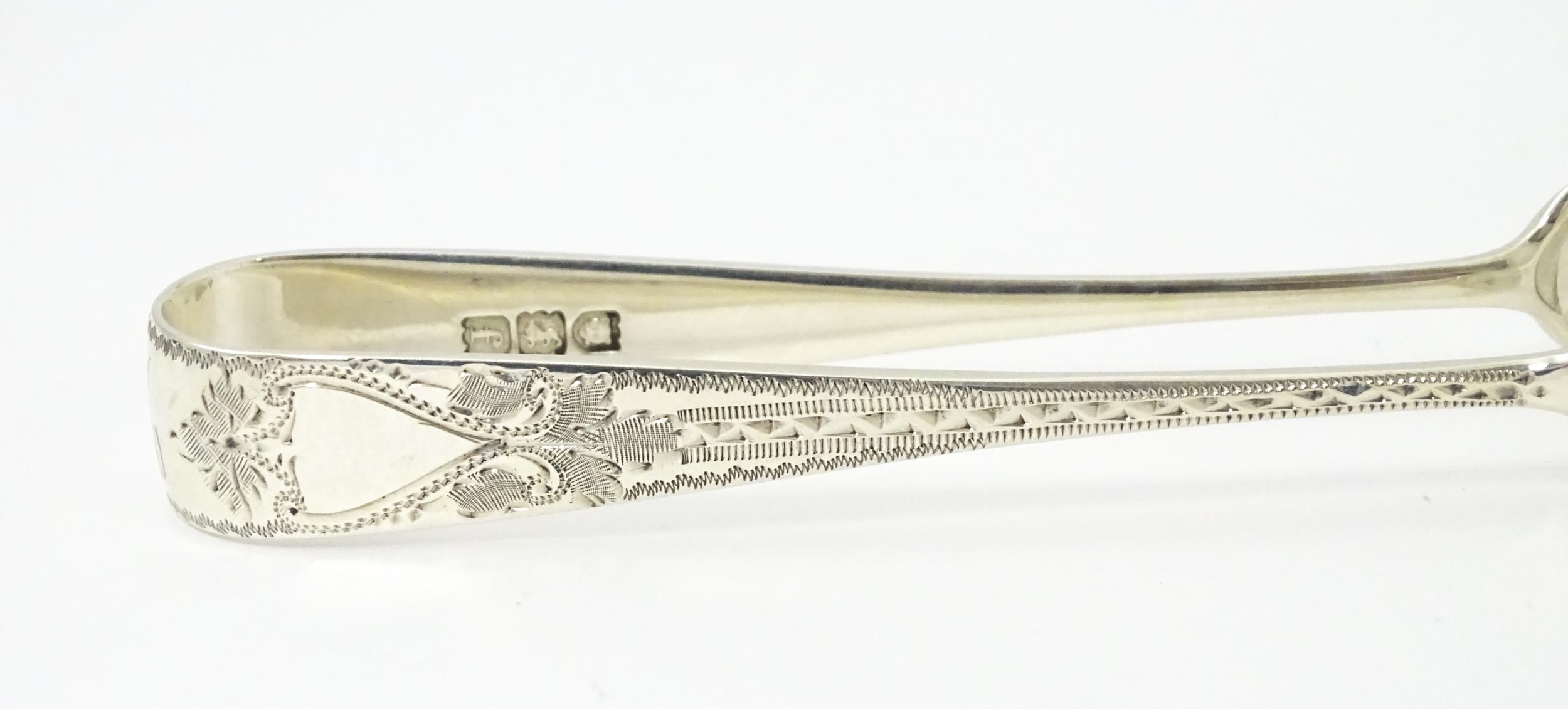 Silver sugar tongs with bright cut engraved decoration Hallmarked London 1901 maker Josiah - Image 4 of 8