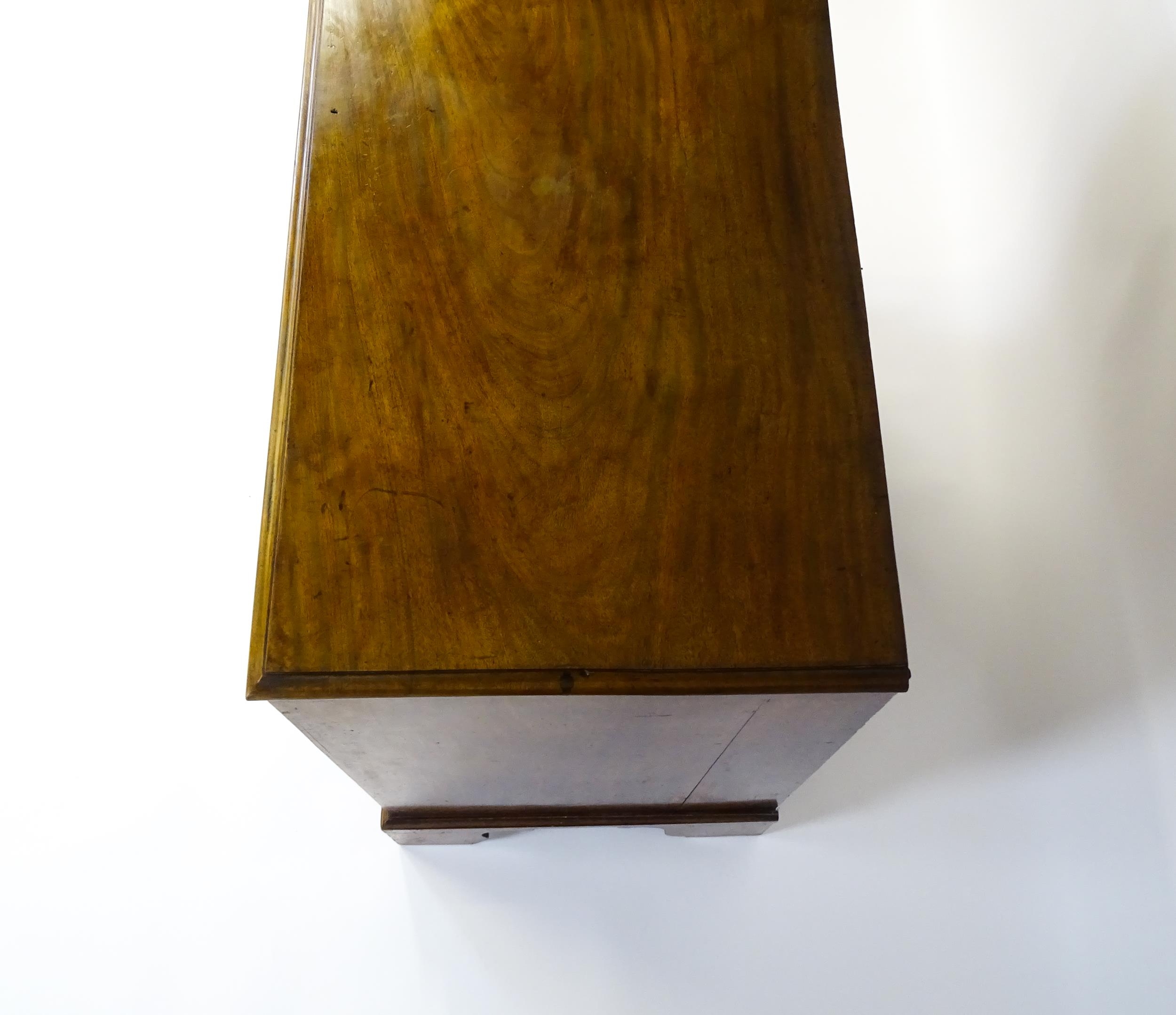 A late Georgian mahogany chest of drawers with a rectangular moulded top above three long drawers - Image 6 of 10