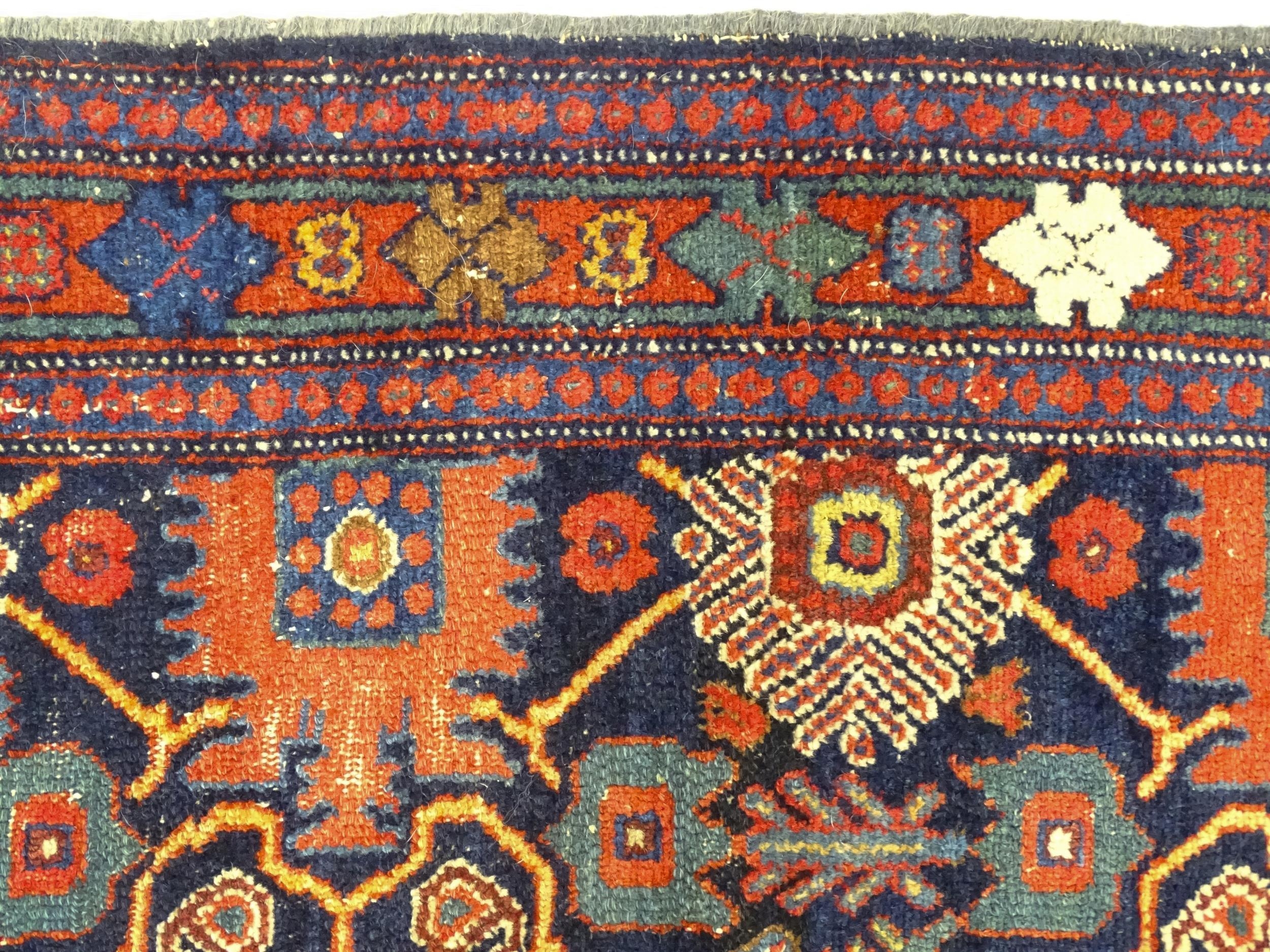 Carpet / Rug: A blue ground rug decorated with repeating geometric motifs of stylised floral and - Image 4 of 8