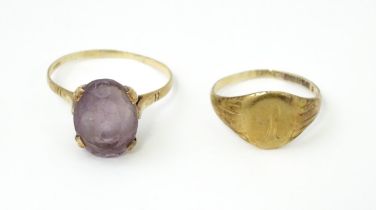 Two 9ct gold rings. One set with amethyst Ring size approx. X, the other a signet ring Ring size