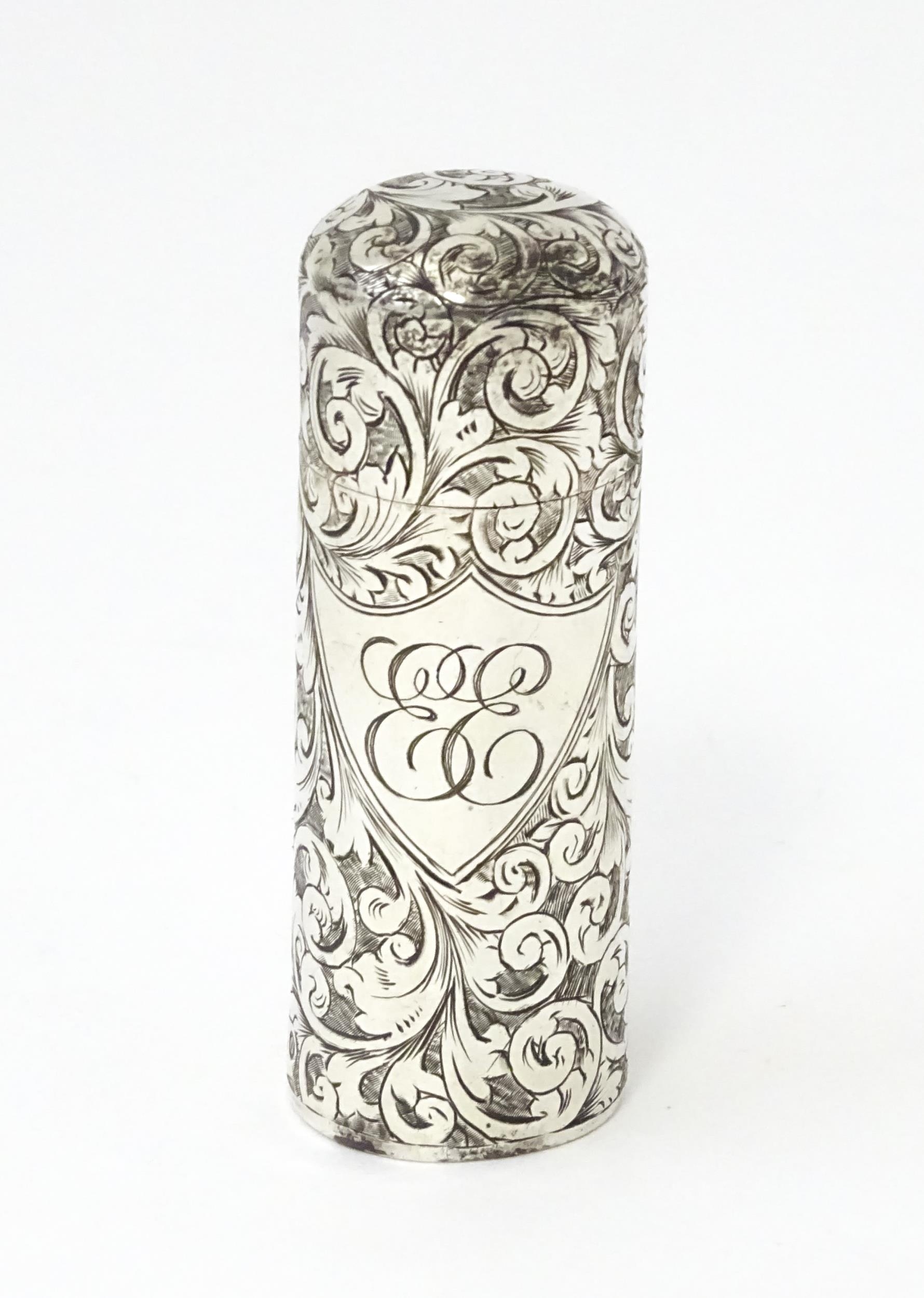 A silver scent / perfume bottle with engraved decoration opening to reveal gilded interior and - Image 9 of 9