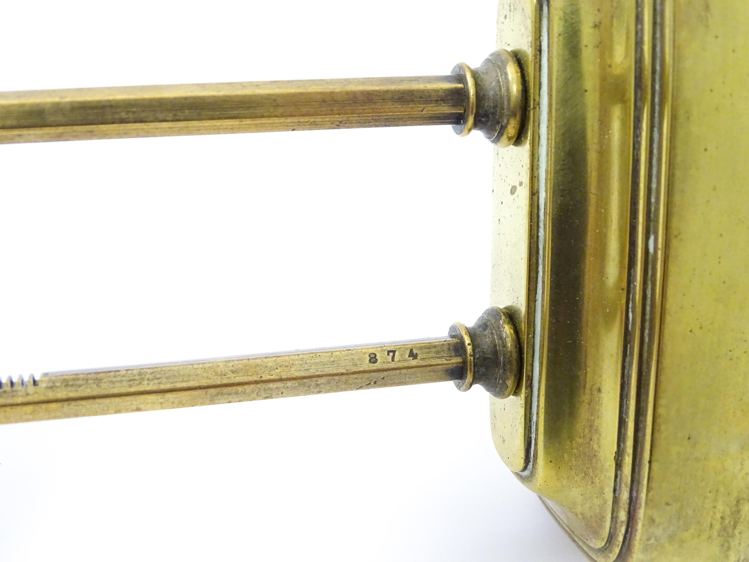 A brass cased Gravity clock with dial with Arabic numerals and having exposed escapement. Marked - Image 8 of 9