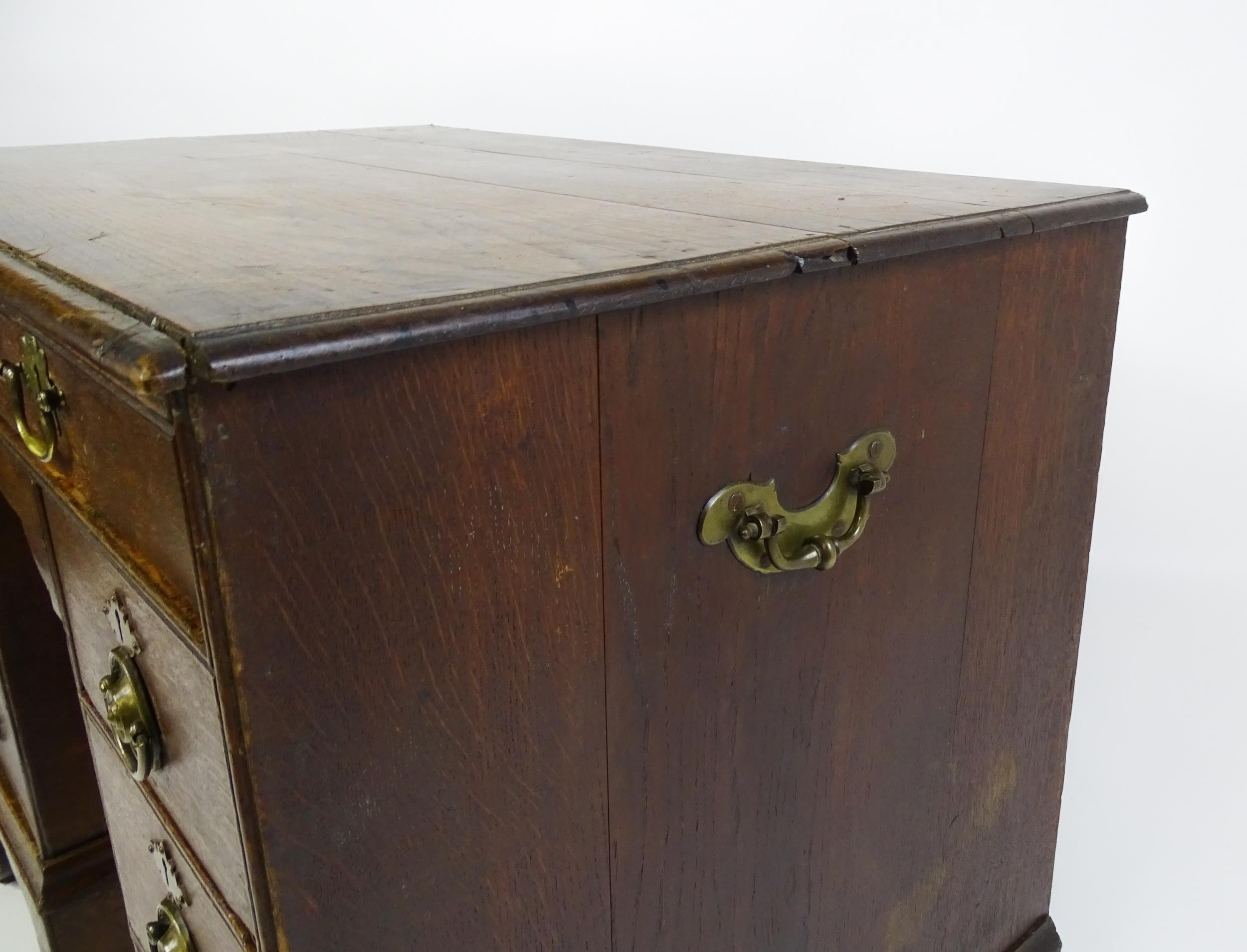 An early / mid 18thC oak kneehole desk with a moulded top above two short drawers and two banks of - Image 8 of 10